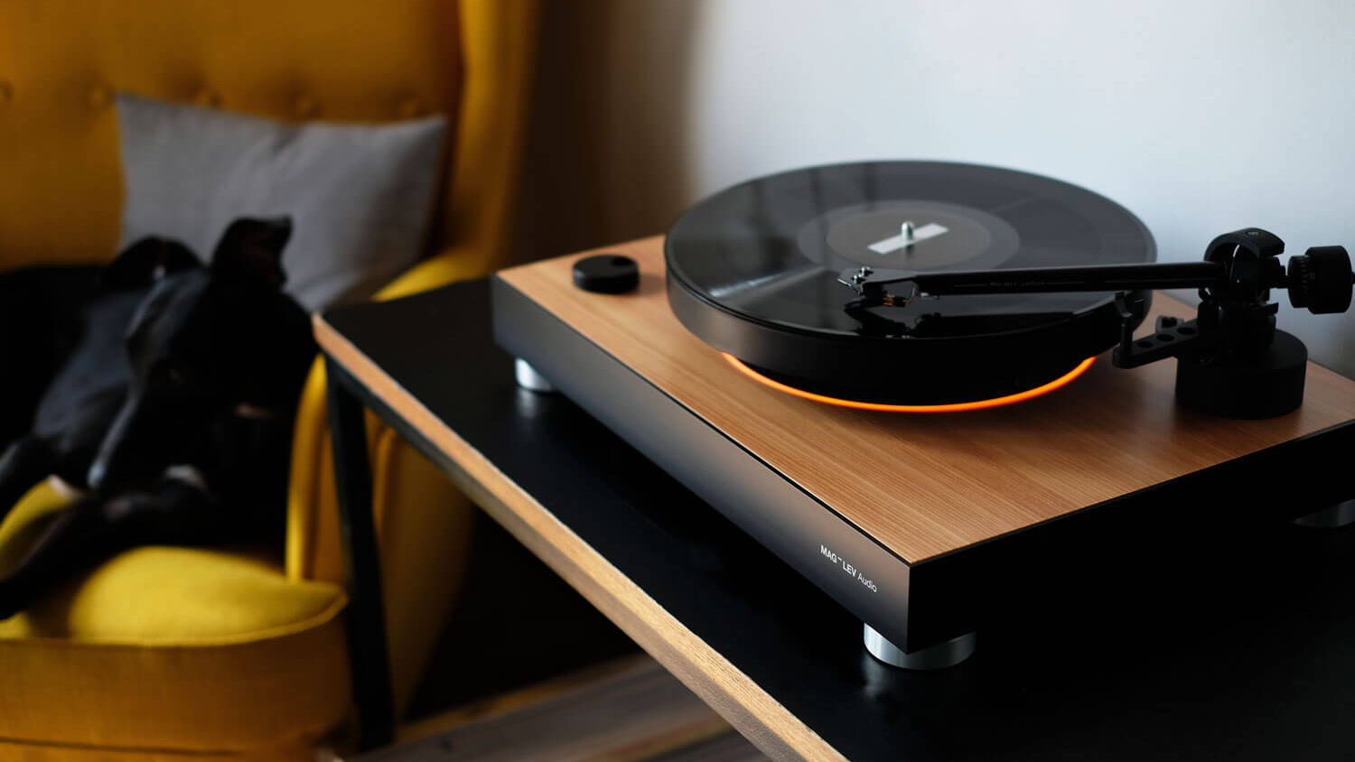 Top detail of the MAG-LEV Audio ML1 Wood turntable showing the speed selector and natural wood finish.